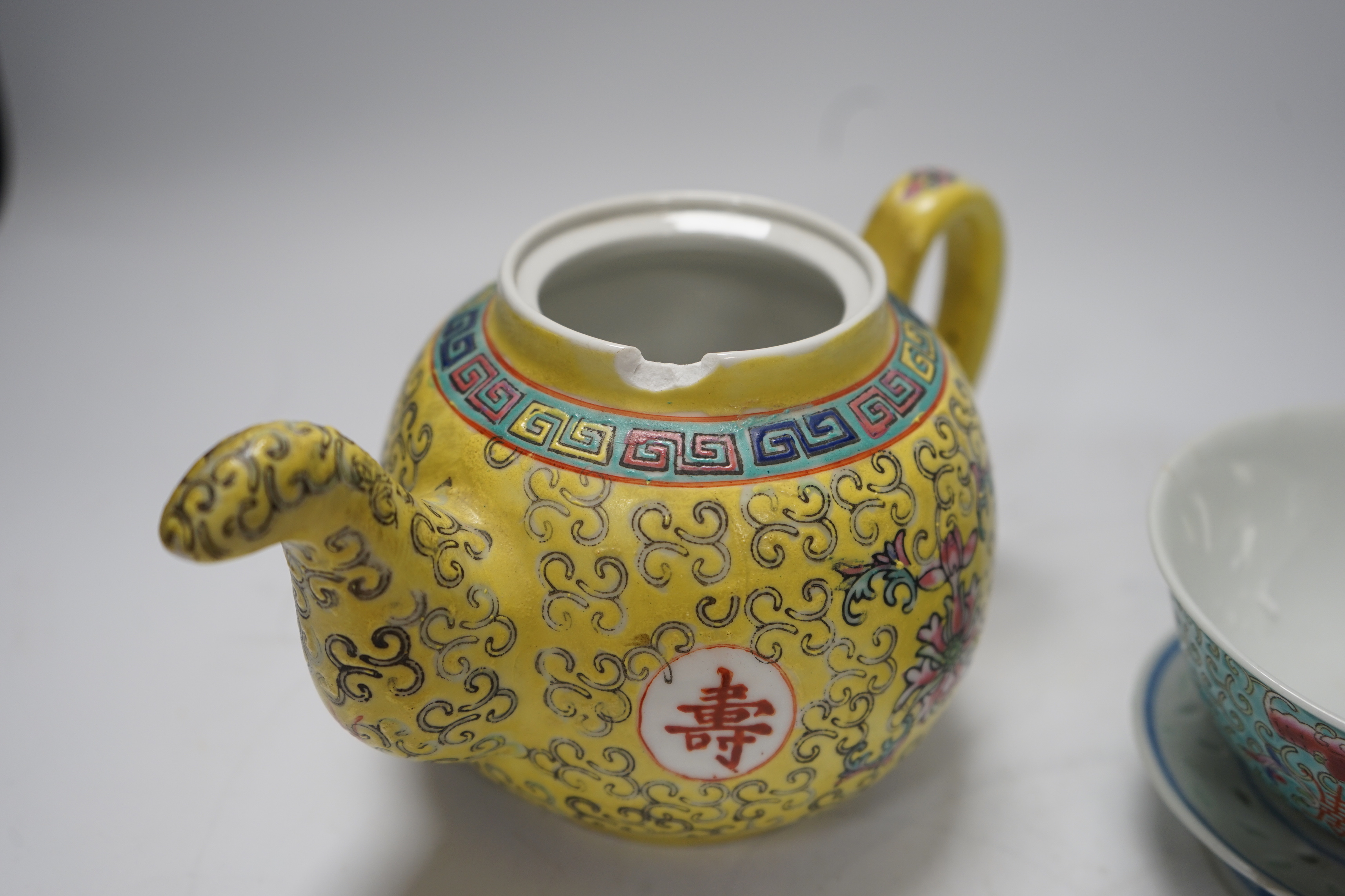 Six Chinese ceramic items; a teapot, two bowls and three small dishes, teapot 10cm